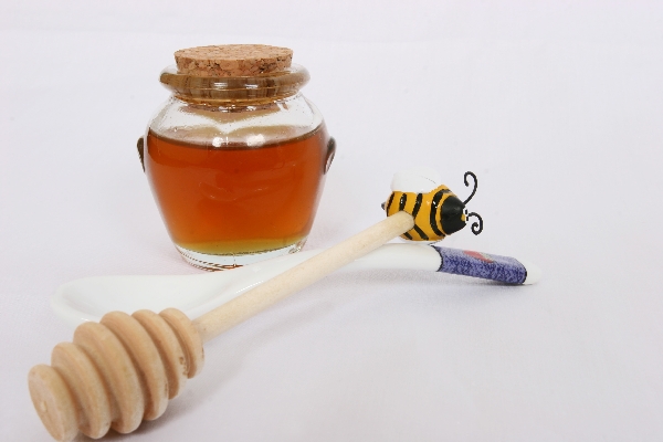 honey pot with some honey